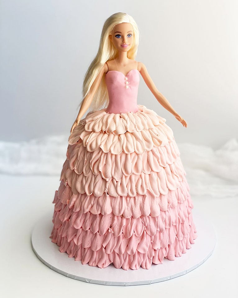 Pink dolly varden princess cake with buttercream icing dress.