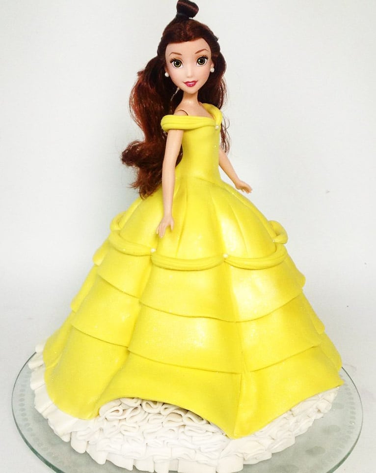Kid's birthday cake shaped like Disney's Belle.