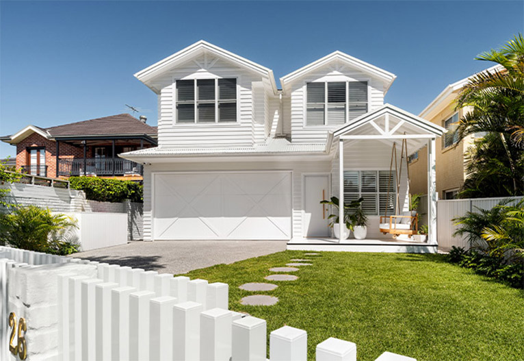 Front of a white weatherboard house in Sydney.