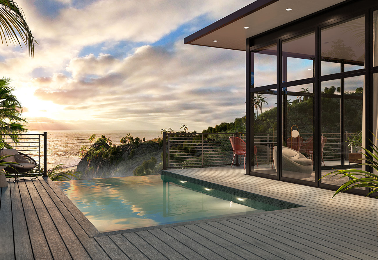 An infinity pool surrounded by a modern pool deck at sunset.