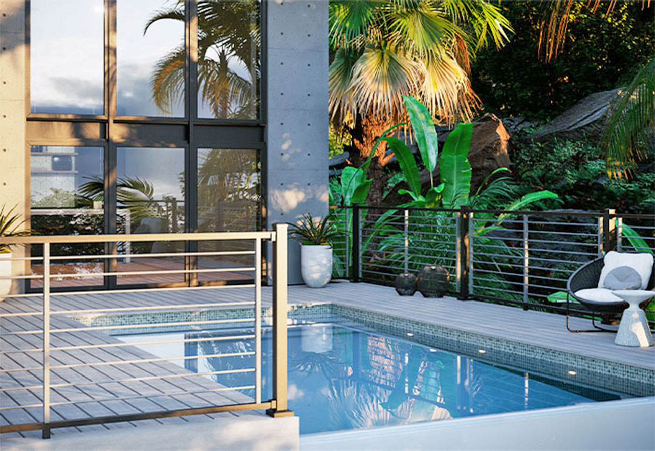 Small pool installed on the fenced composite deck of a modern home.