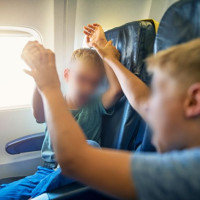 'I Sat Next To Two Naughty Kids During A Flight, While Their Parents Sat Behind Us'