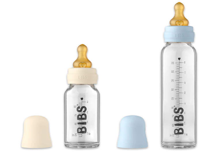 BIBS glass baby bottles shown in white and blue colours with matching lids.