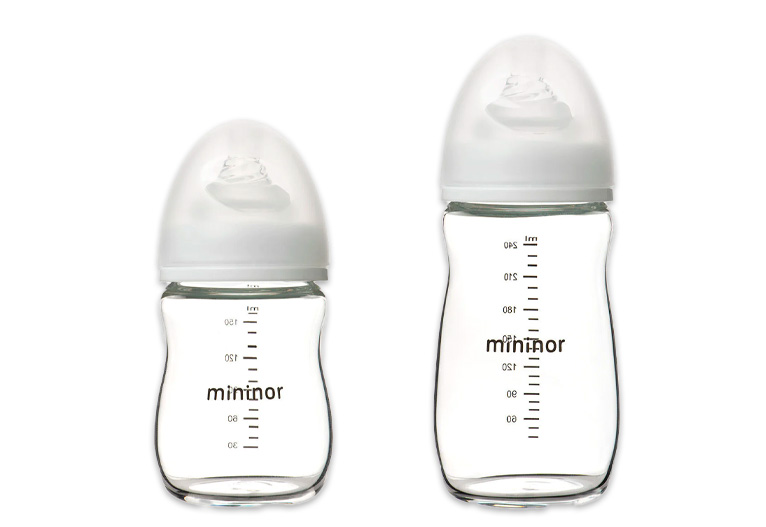 Mininor glass baby bottles shown in two sizes.