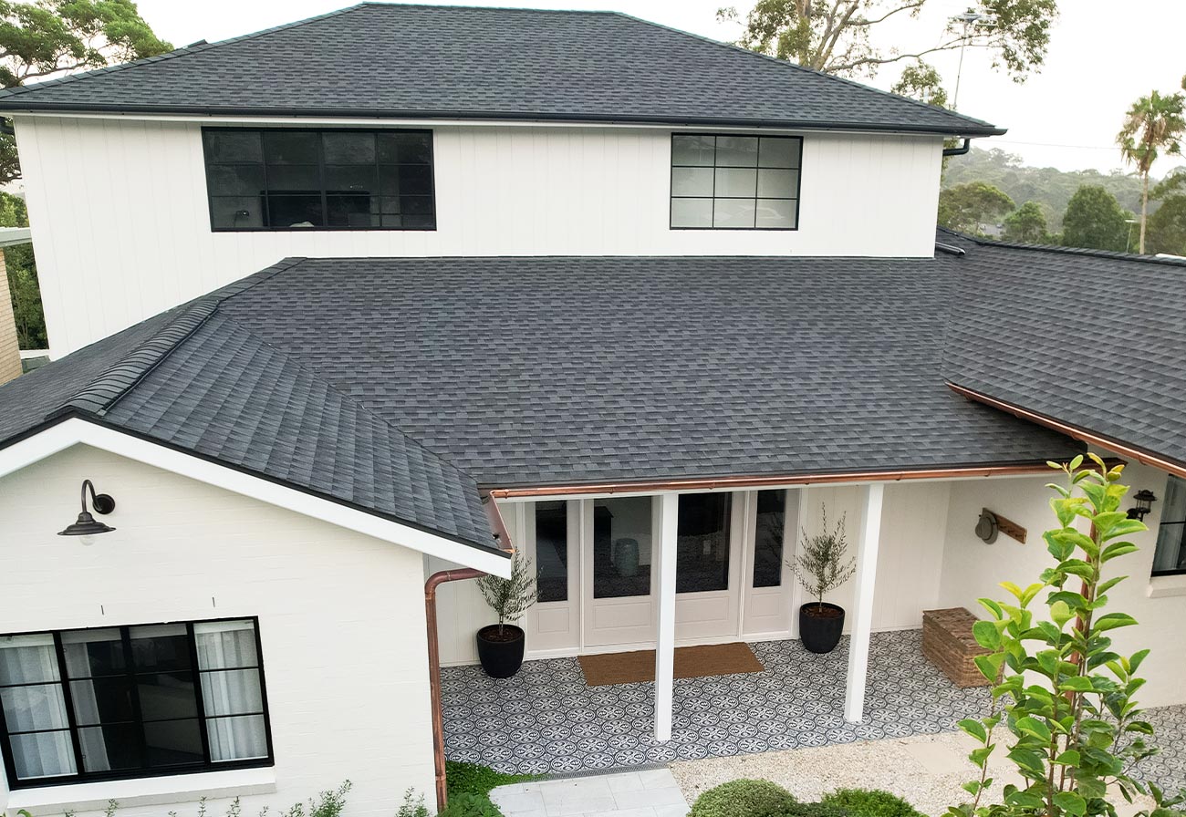 Asphalt Roof Singles were the inspiration for this Modern Farmhouse!