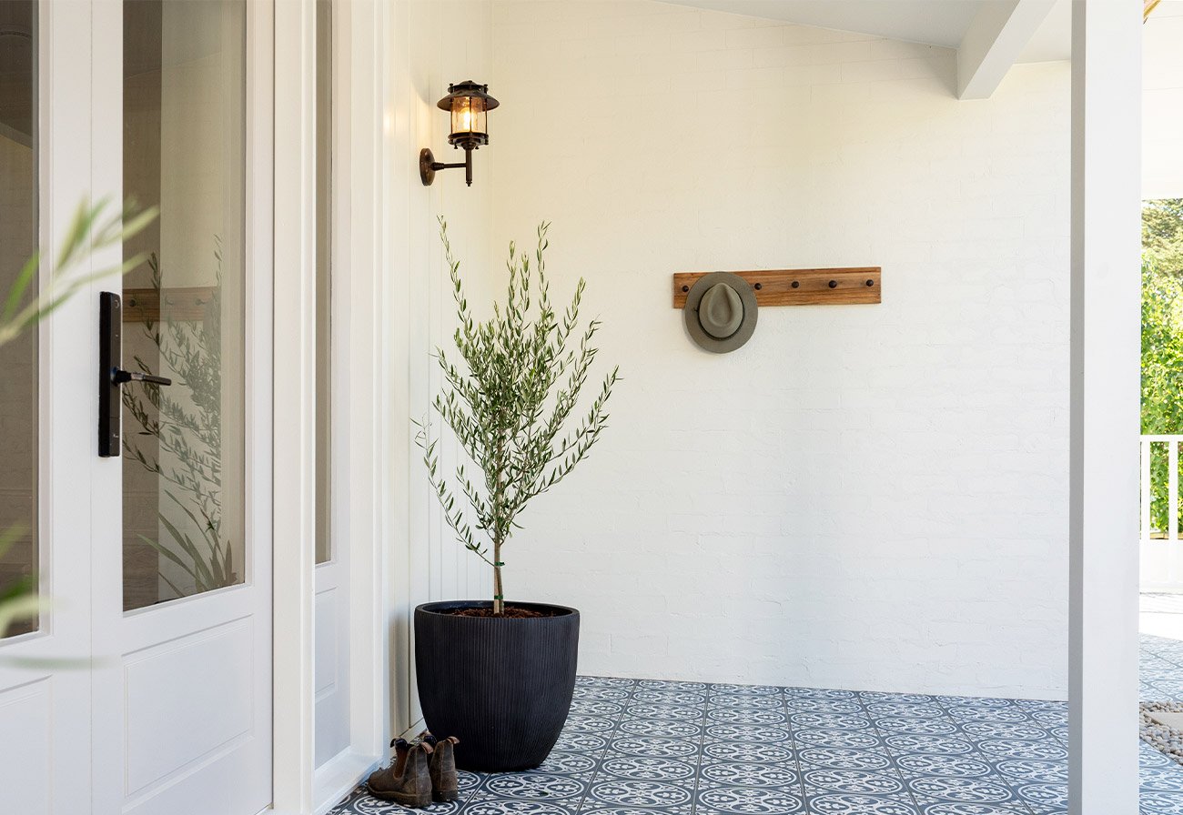 The Turner Wall Light creates a welcoming touch to the entrance