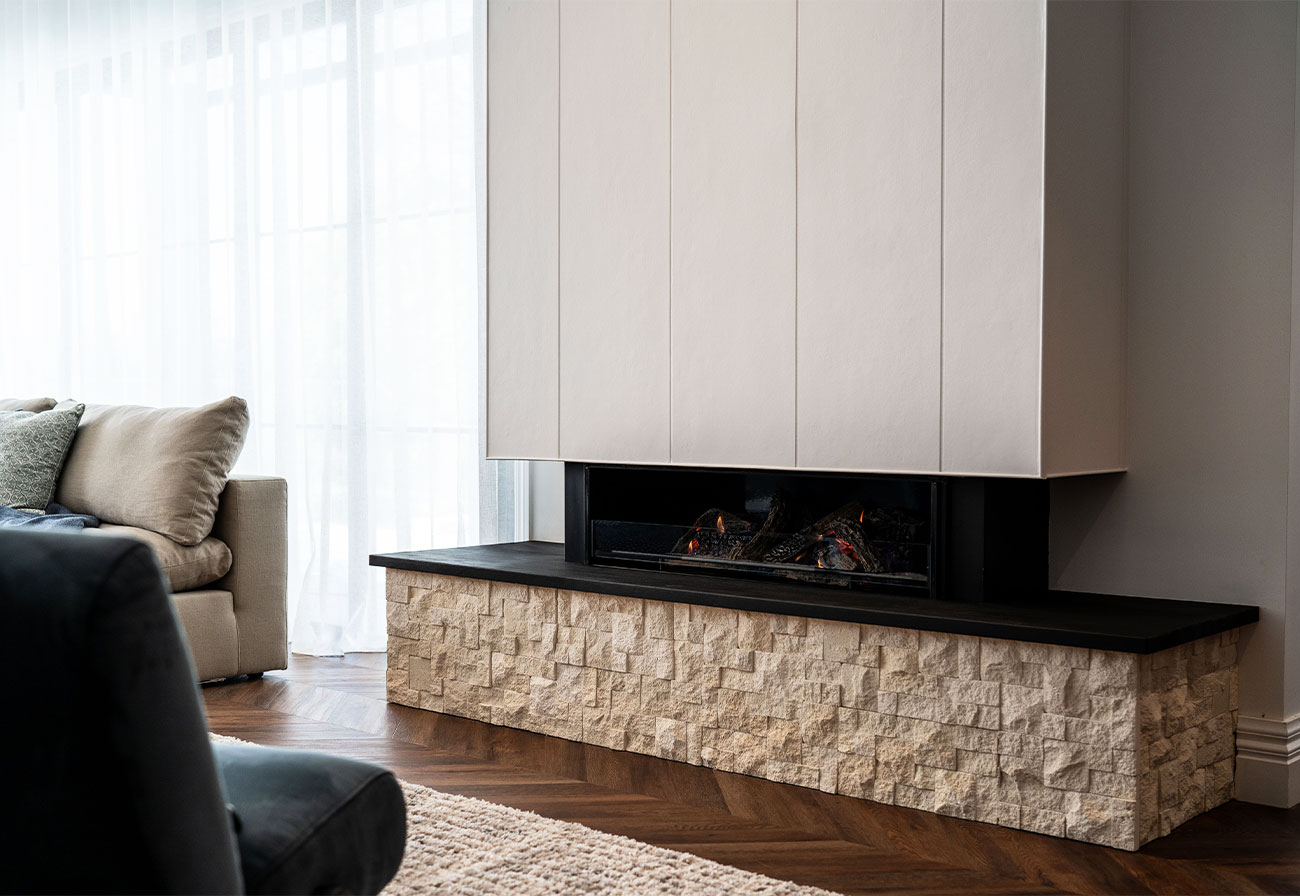 Axon™ Cladding above a living room fireplace.