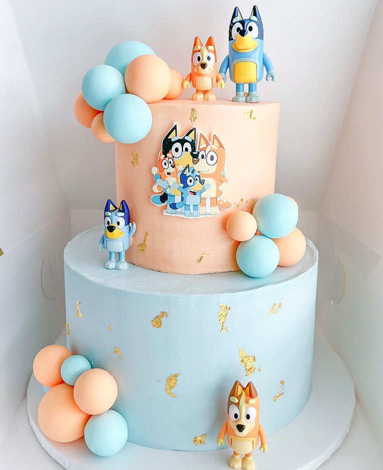 Tiered Bluey and Bingo cake. Source: marcelas.cakes