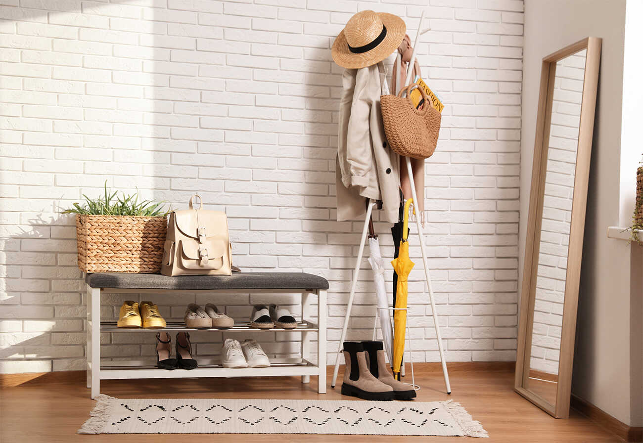 Entryway with coat hanger and shoe rack.