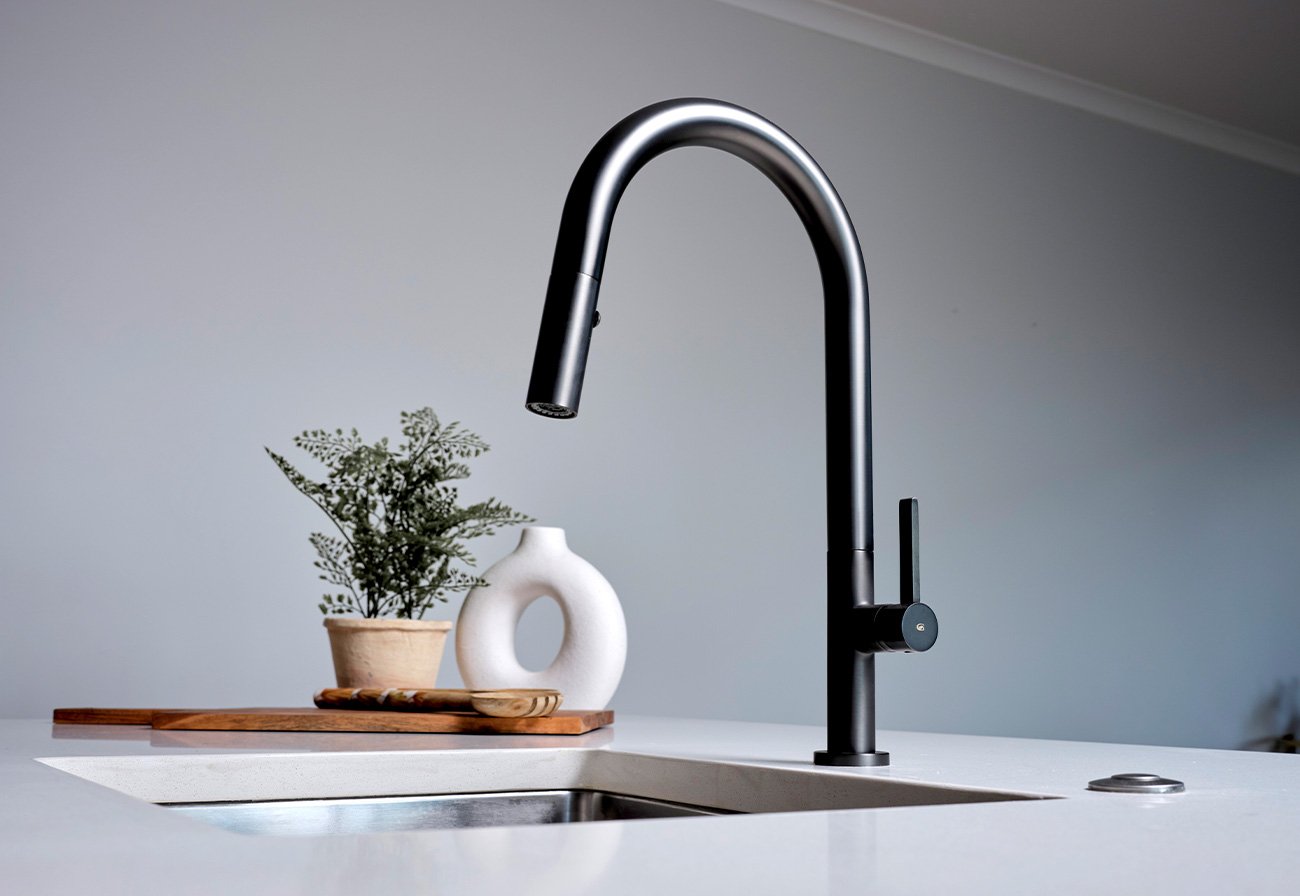 Matte Black pull-down mixer tap on a white bench.