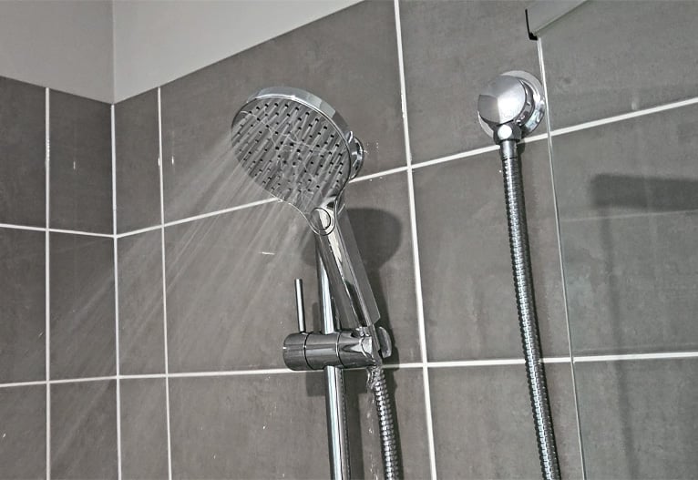 The Greens BubbleJet shower head turned on.