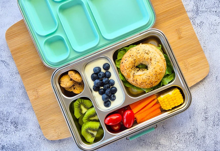 EcoCocoon Leak-Proof Lunch Box with a bagel and fresh food inside.