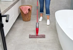 Vileda ProMist Max Flip Mop on a tiled bathroom floor.