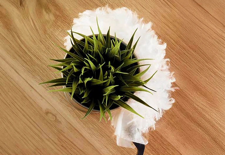 Vileda Flex & Catch Duster wrapped around a pot plant.