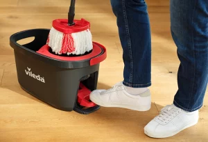 Person using the Vileda Easy Wring & Clean TURBO mop system.