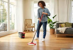 Person using the Vileda Easy Wring & Clean TURBO mop system.