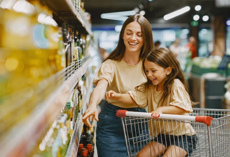Mother and daughter shopping for groceries at IGA.